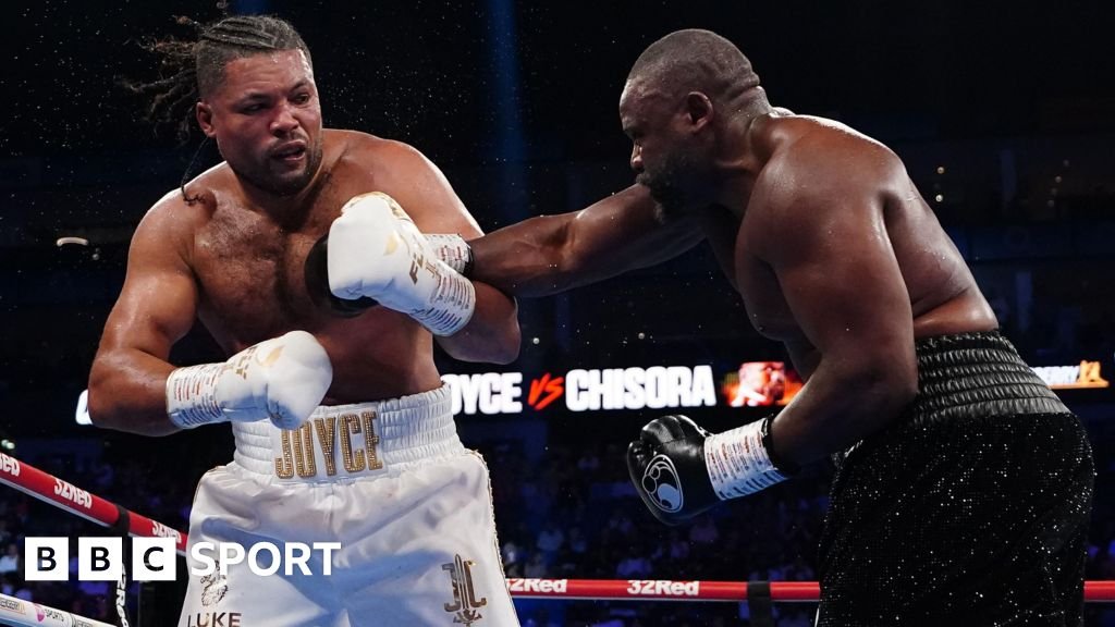 Derek Chisora throws a right hand at Joe Joyce